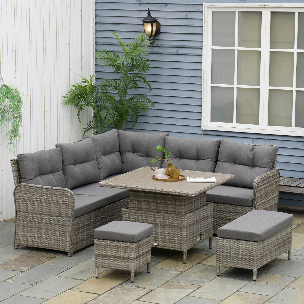 Outsunny rattan corner sofa set arranged in a garden setting