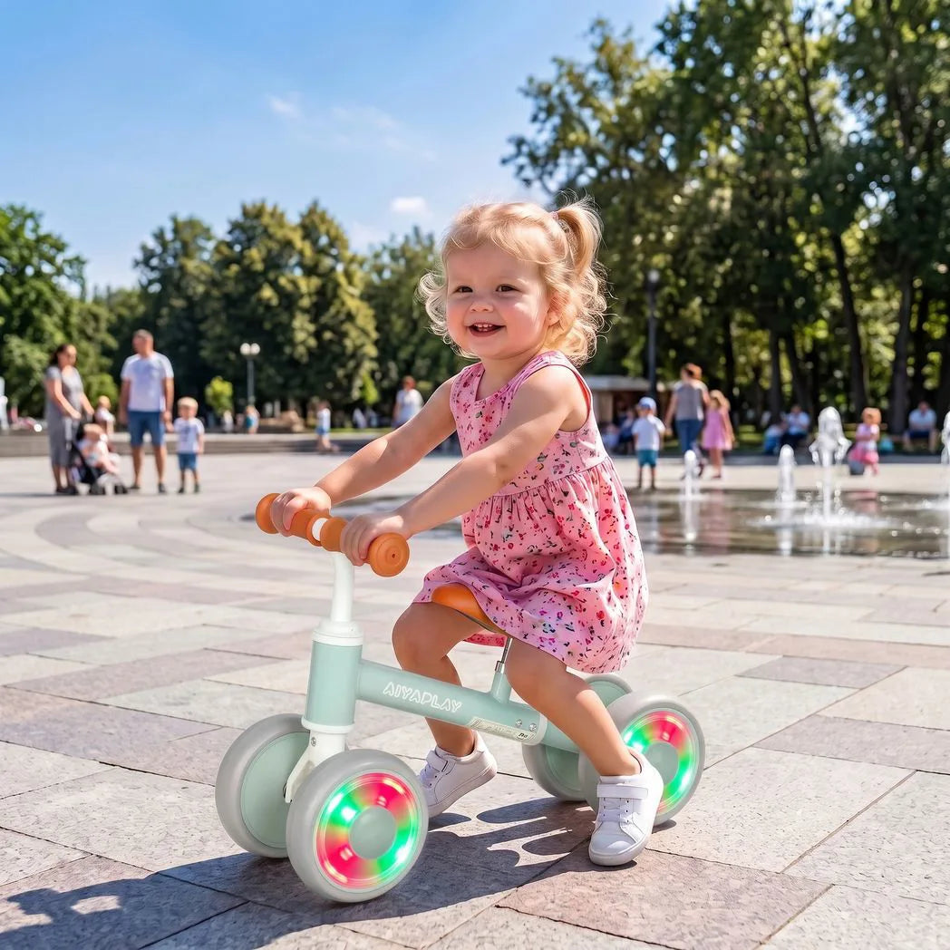 AIYAPLAY Baby Balance Bike for 1–2 Years with Four Light-up EVA Wheels and Adjustable Seat – Toddler Ride-On, Green
