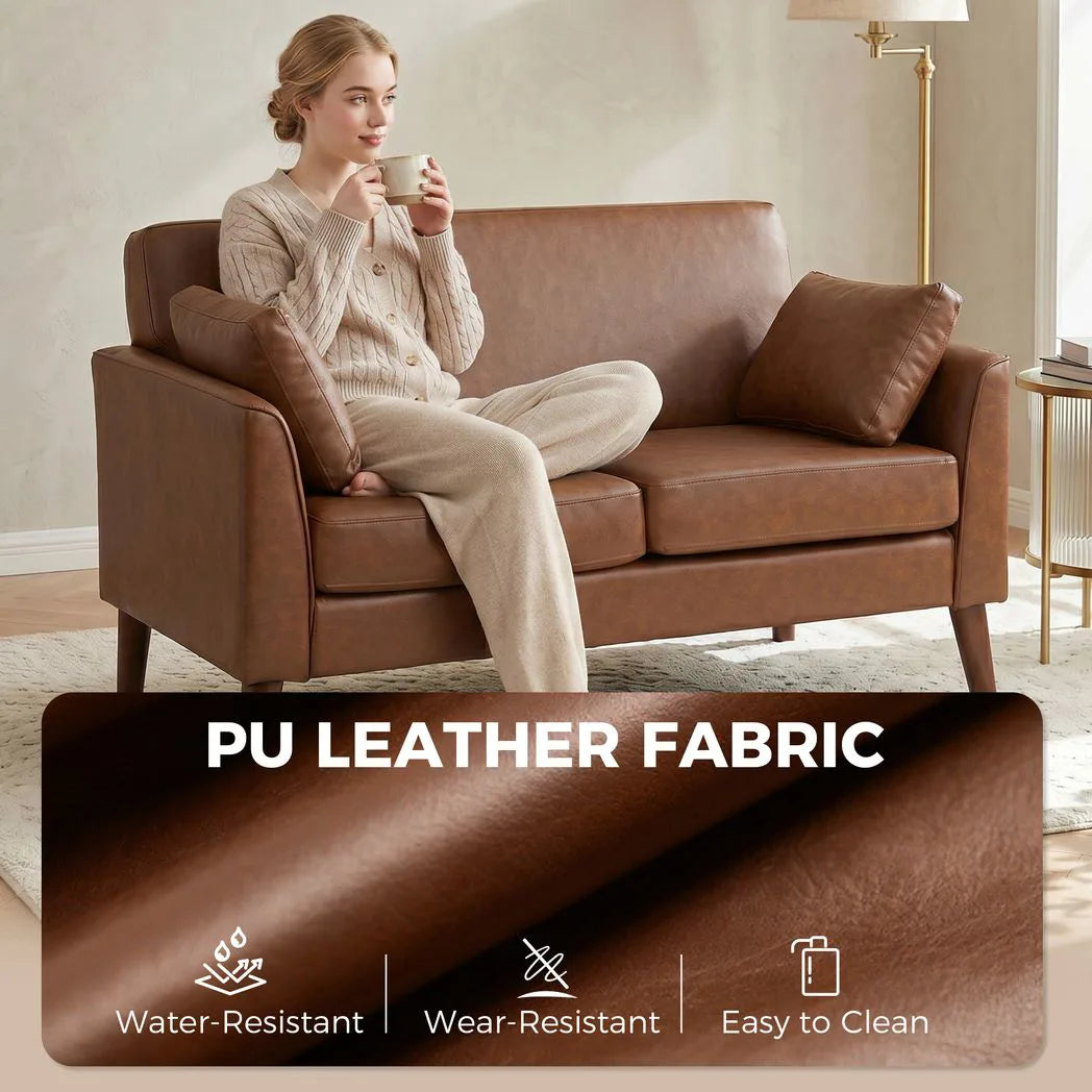 HOMCOM 2 Seater Sofa, 132 cm Small Loveseat with Solid Wood Legs and 2 Pillows – PU Leather Couch for Small Spaces, Brown