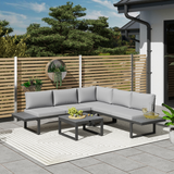Outsunny corner sofa garden set styled on a decked patio with wooden fence