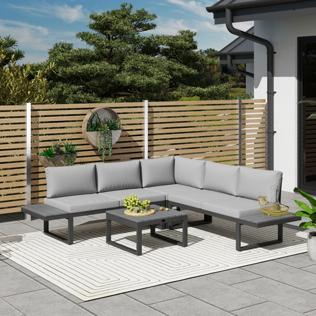 Outsunny corner sofa garden set styled on a decked patio with wooden fence