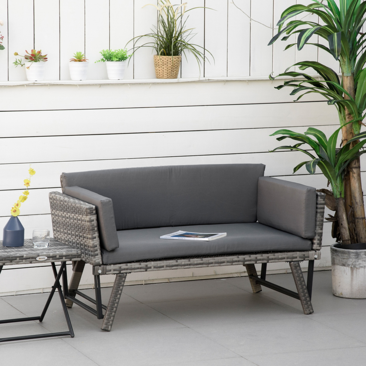 Outsunny rattan daybed sofa converted into a bed