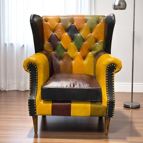 Close-up of patchwork leather texture on wingback armchair