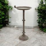Antique iron birdbath and feeder