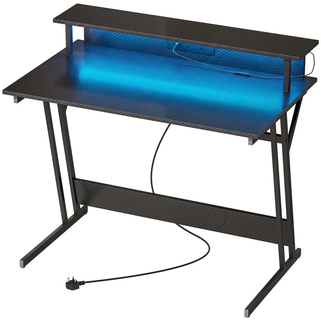 HOMCOM Two-Level LED Gaming Desk with Carbon Fibre Top, Power Outlets & USB Ports – Black Computer Desk