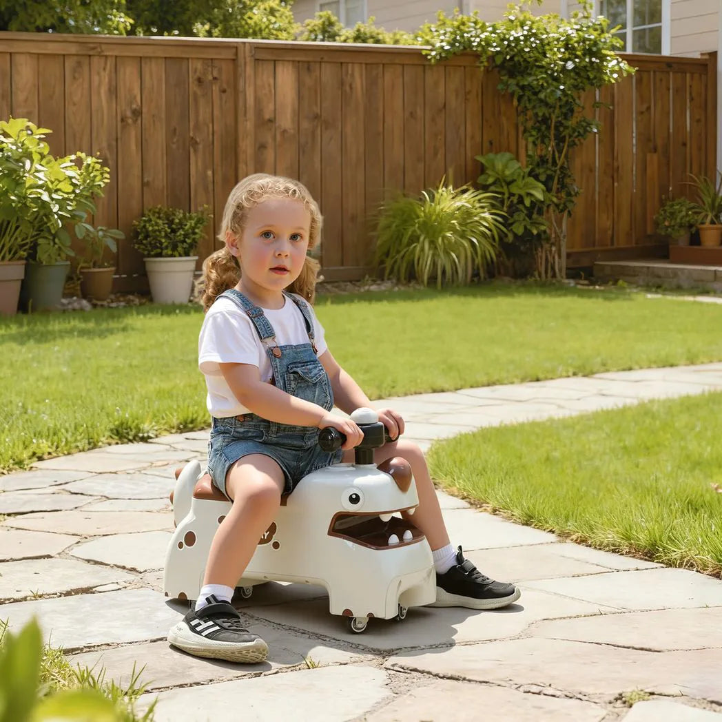 AIYAPLAY Kids Dinosaur Ride On Car with Lights, Sounds and Storage – Foot to Floor Toddler Walker, Cream