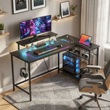 HOMCOM Reversible L-Shaped Gaming Desk with LED Lights, Monitor Stand & Power Outlets – Home Office, Black