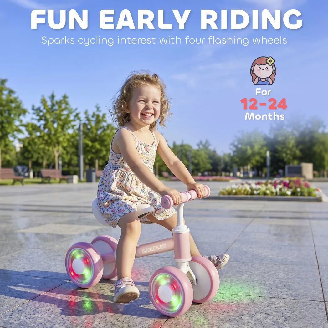 AIYAPLAY Baby Balance Bike for 1–2 Years with Four Light-up EVA Wheels and Adjustable Seat – Toddler Ride-On, Pink