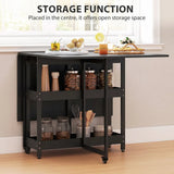 HOMCOM Drop Leaf Dining Table for 2–4 People with Open Shelves and Wheels – Folding Kitchen Table, Black