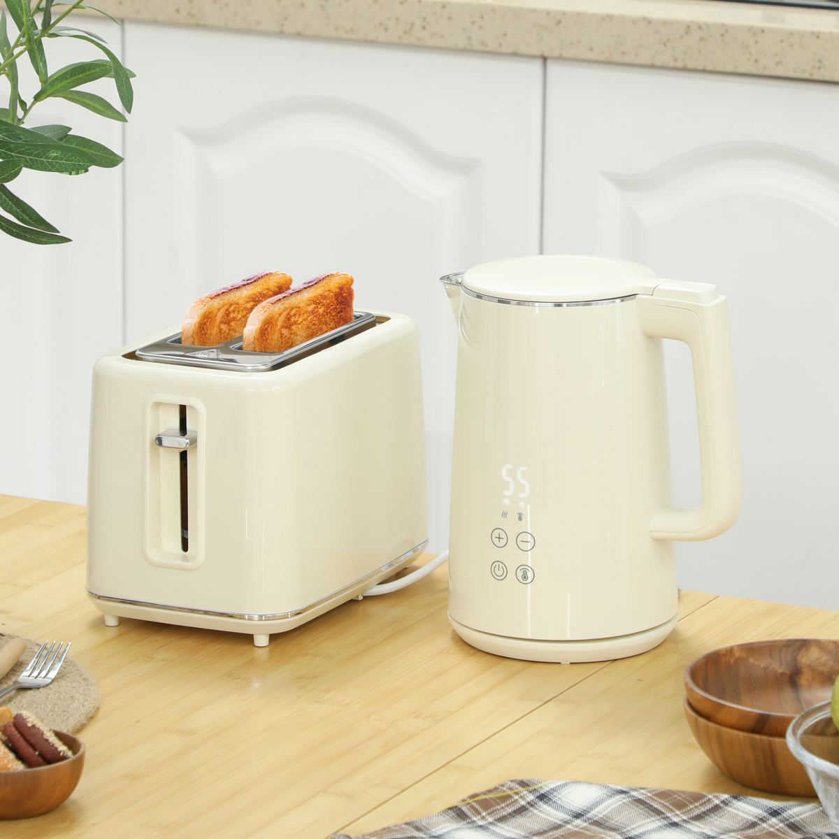 Stainless steel and beige kettle and toaster set